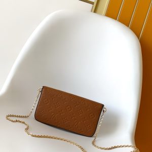 Alternative view of p500M83025 Blue M15968 Print M14193 Chocolate Brown M14227 Purple-Gray M83589 New Blue M27048 Pearl Blue M69977 Gray M80428 Black M82047 Cream White M81759 Pink M82349 Blue M82480 Green M64064 Black M82363 Cream White M68697 Apricot M67856 Pink M64099 Blue M63700 Bright Red M81531 Earth Yellow This Pochette Félicie chain bag features Monogram Empreinte leather embossed with the Monogram pattern. Its envelope-style shape includes a removable inner pouch.Attach the chain to effortlessly switch between clutch and shoulder bag styles.21.0 x 12.0 x 3.0 cm (L x H x W) • Monogram Empreinte embossed soft grained calf leather • Fabric lining • Metal hardware • Snap closure • Large compartment • Interior patch pocket • Detachable zippered pouch • Detachable patch pocket with card slots • Chain: Detachable • Chain drop: 173 cm